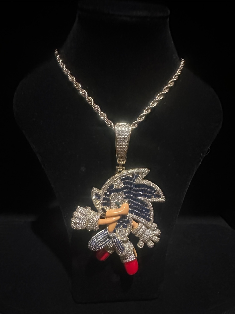 Gold-Tone Sonic Pendant Necklace with Blue, Red and Tan Accents